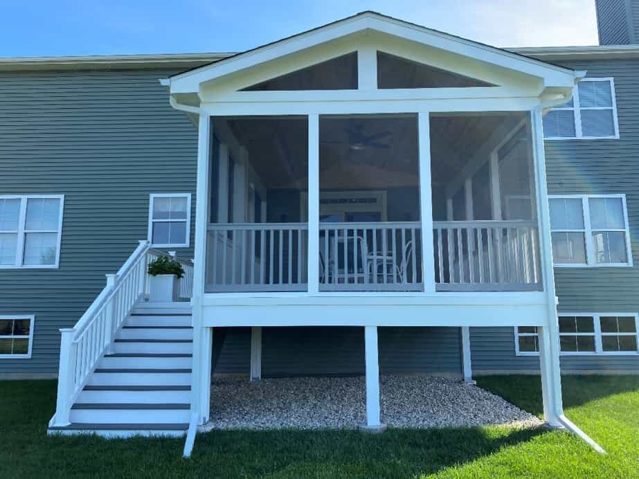 Outside of a gorgeous white screened porch with composite stairs in Naperville, IL.